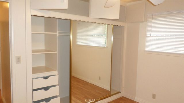 a view of an empty walk in closet