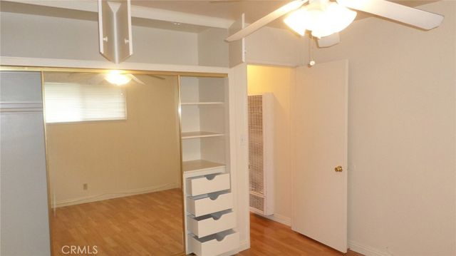 a bathroom with a shower and a glass door