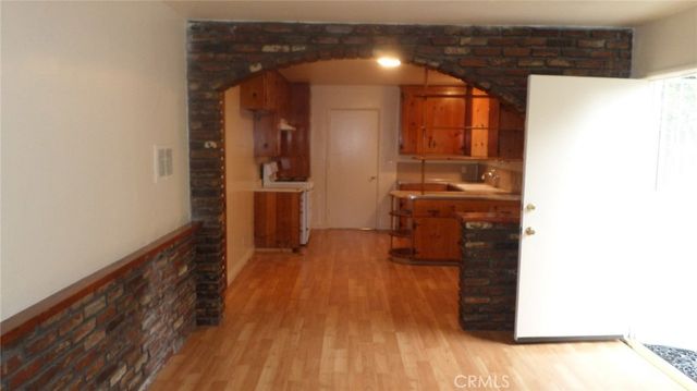 a hallway with wooden floor