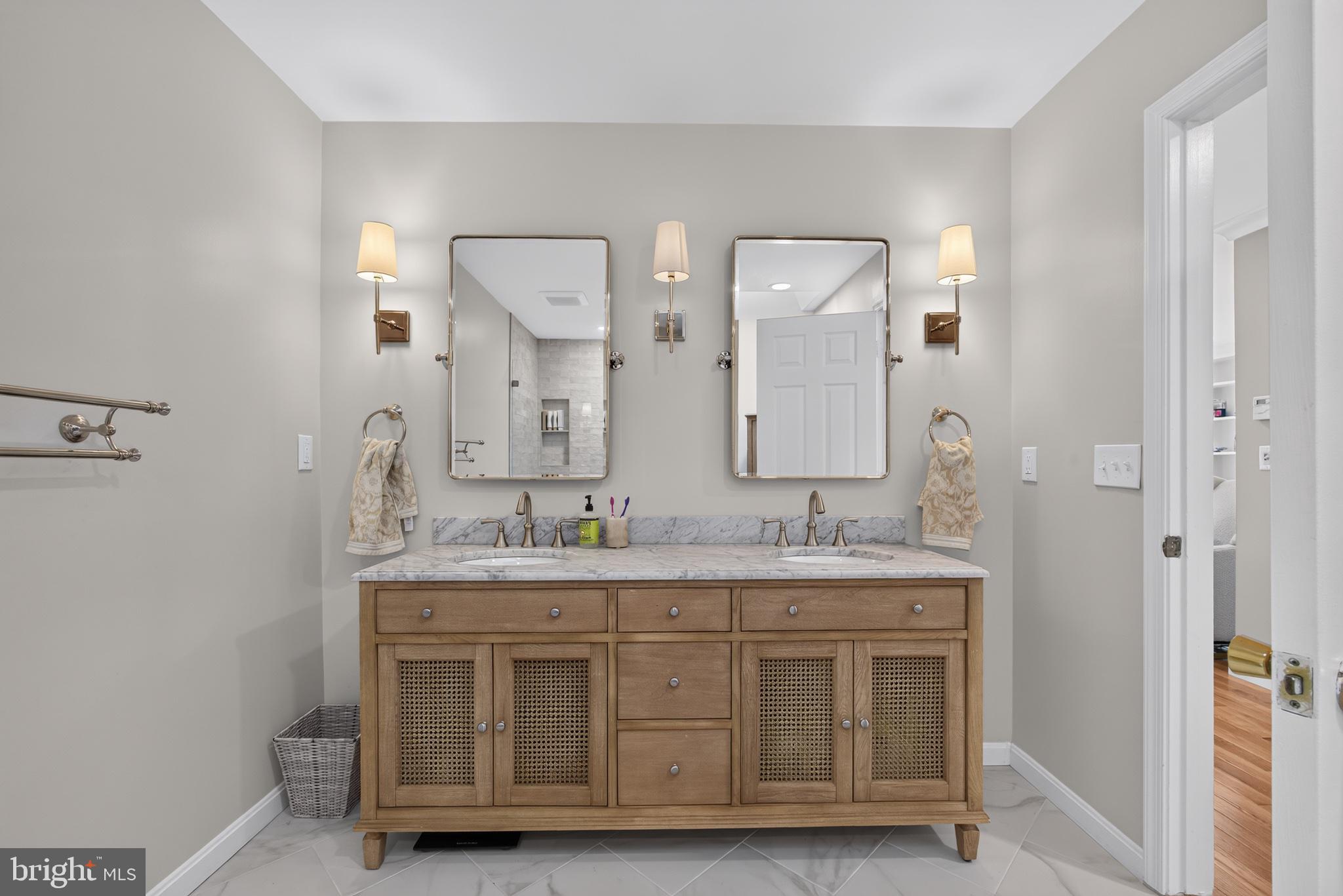 108 Spot Club Road Arnold, MD 21012 - Photo 18 of 30 Elegant bathroom with dual mirrors.