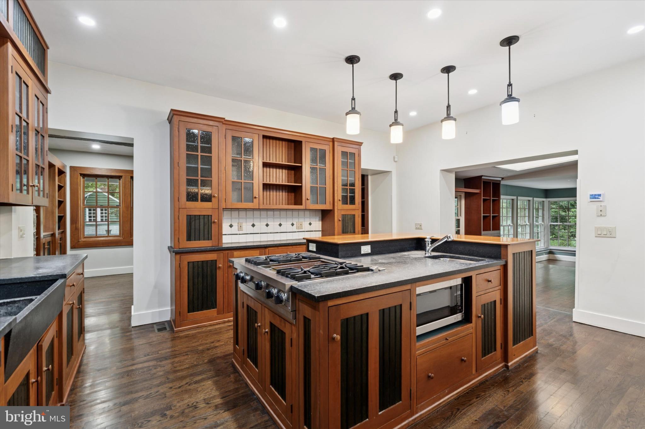 217 Glenn Road Ardmore, PA 19003 - Photo 21 of 65 a kitchen that has a stove and a wooden floor