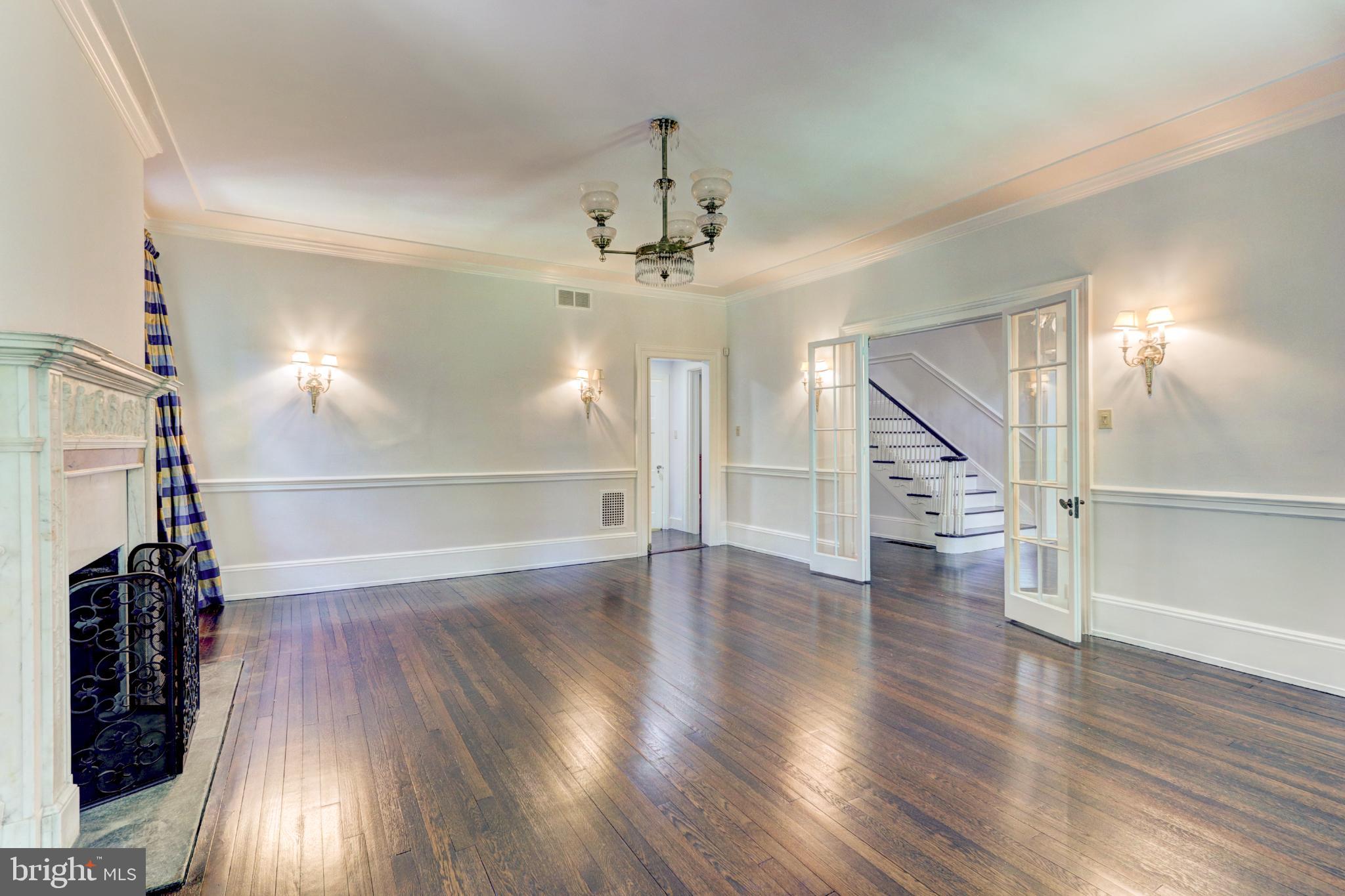 217 Glenn Road Ardmore, PA 19003 - Photo 28 of 65 a view of a room with wooden floor staircase and a kitchen