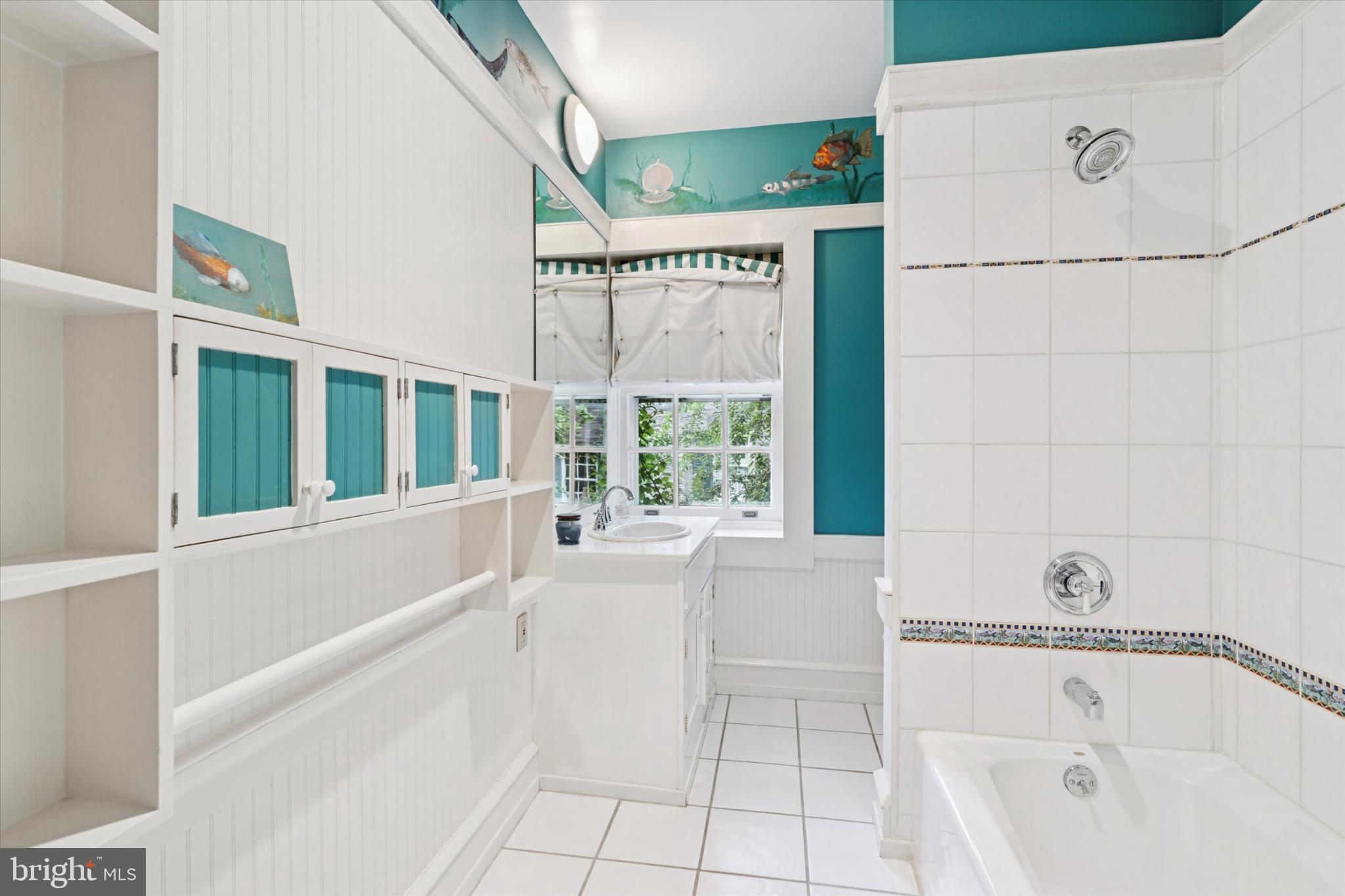 217 Glenn Road Ardmore, PA 19003 - Photo 46 of 65 a bathroom with a bathtub and a shower