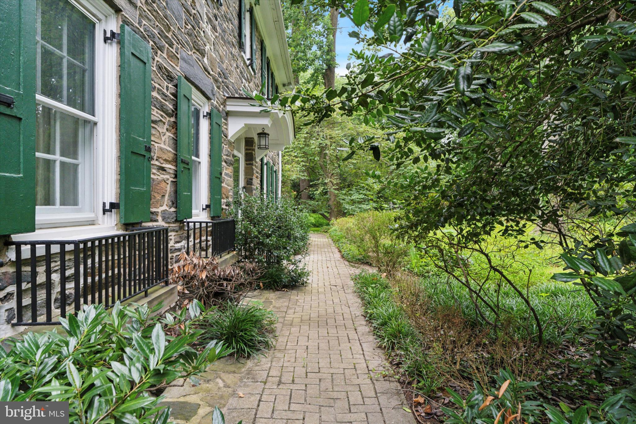 217 Glenn Road Ardmore, PA 19003 - Photo 5 of 65 a view of a pathway with a garden