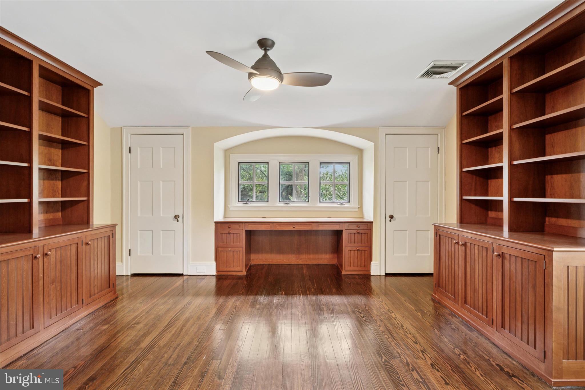 217 Glenn Road Ardmore, PA 19003 - Photo 51 of 65 a view of an empty room with a window and wooden floor