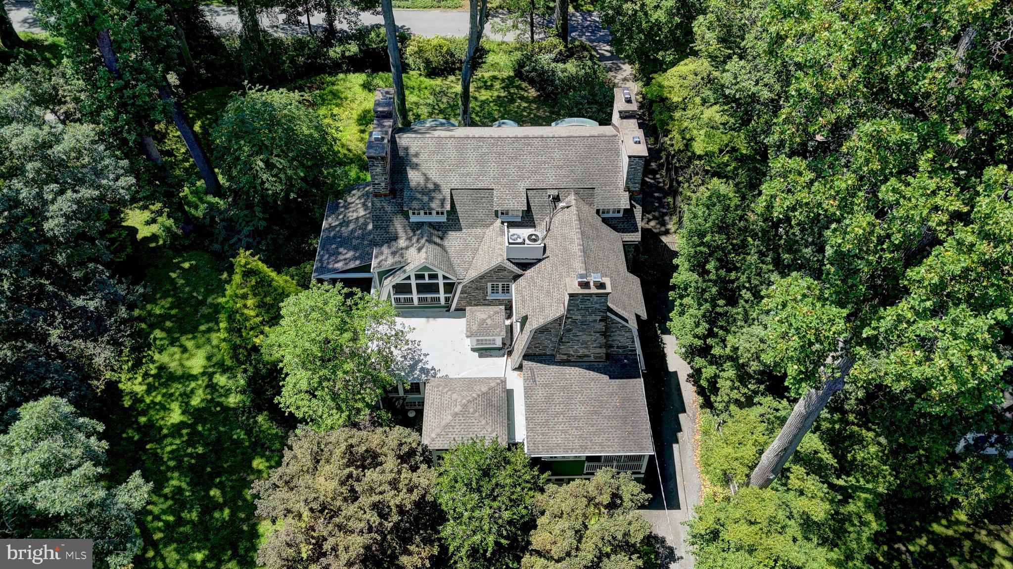 217 Glenn Road Ardmore, PA 19003 - Photo 64 of 65 an aerial view of a house with swimming pool and garden