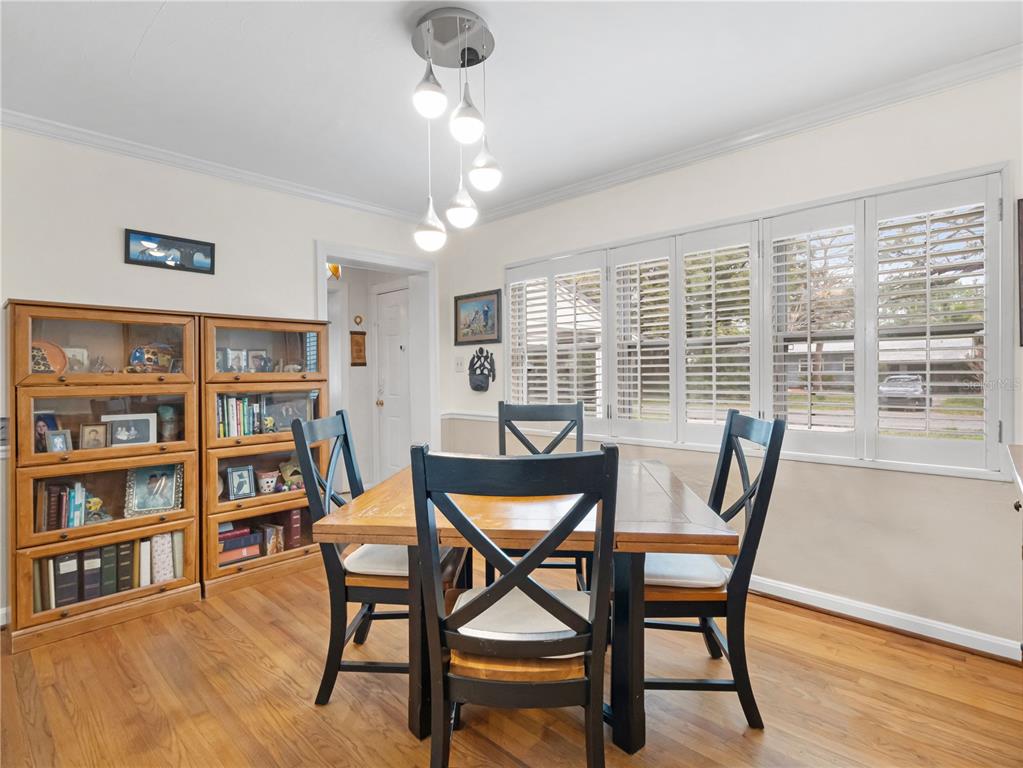 1632 Pinewood Drive Orlando, FL 32804 - Photo 14 of 28 a dining room with furniture and wooden floor