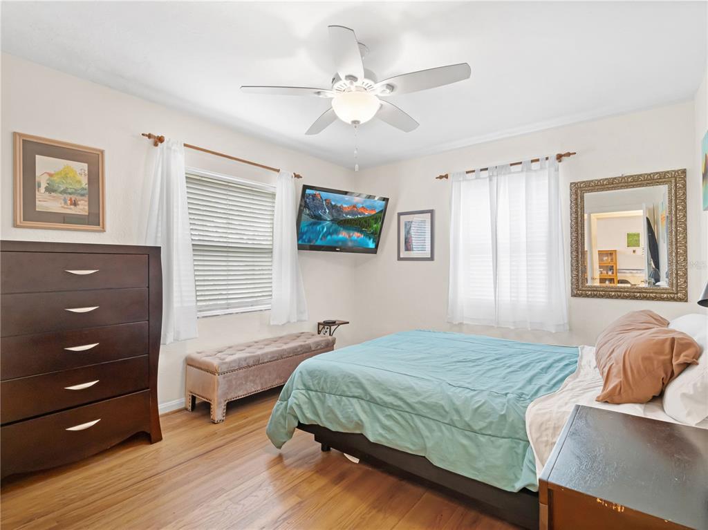 1632 Pinewood Drive Orlando, FL 32804 - Photo 16 of 28 a bedroom with a bed and a dresser