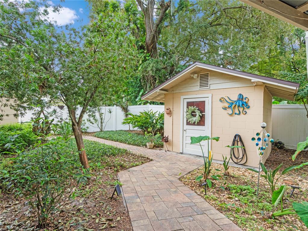 1632 Pinewood Drive Orlando, FL 32804 - Photo 22 of 28 a front view of a house with garden