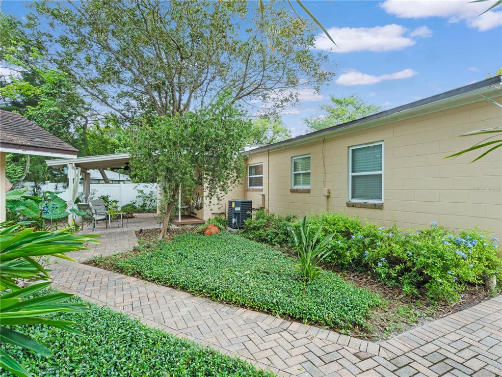 1632 Pinewood Drive Orlando, FL 32804 - Photo 23 of 28 a front view of a house with a garden