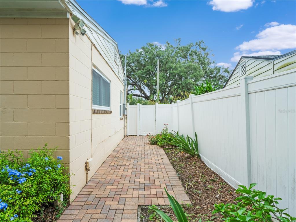 1632 Pinewood Drive Orlando, FL 32804 - Photo 24 of 28 a path view of a house with a yard