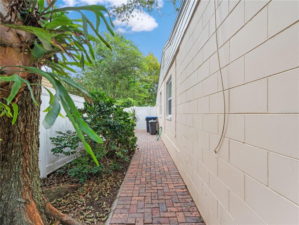 1632 Pinewood Drive Orlando, FL 32804 - Photo 26 of 28 a view of a pathway both side of house