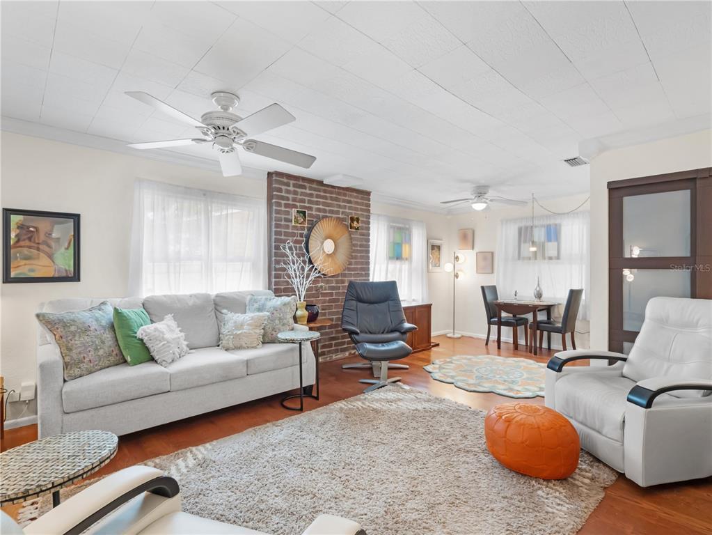 1632 Pinewood Drive Orlando, FL 32804 - Photo 6 of 28 a living room with furniture a couch and wooden floor