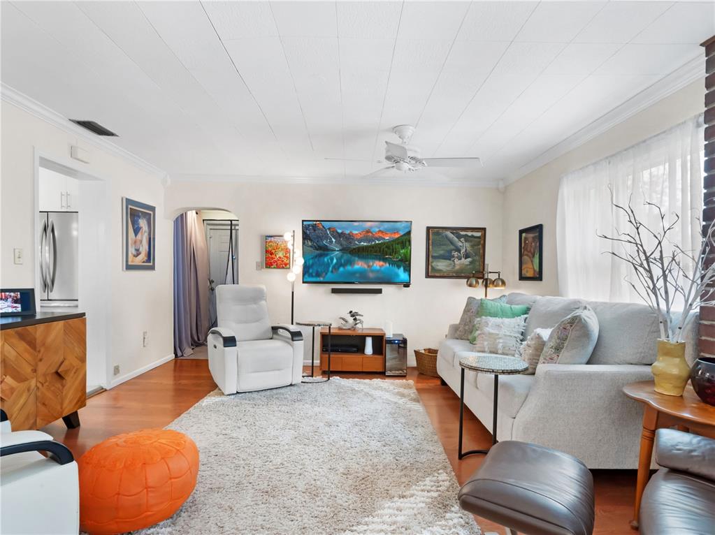 1632 Pinewood Drive Orlando, FL 32804 - Photo 7 of 28 a living room with furniture and a flat screen tv