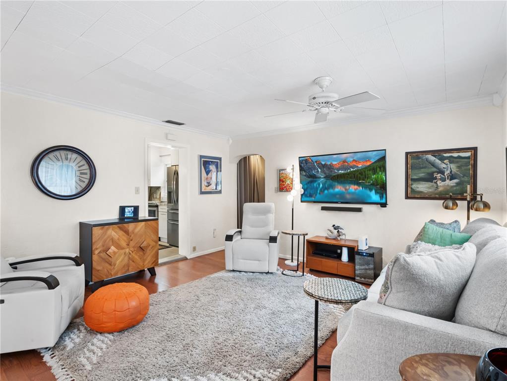 1632 Pinewood Drive Orlando, FL 32804 - Photo 8 of 28 a living room with furniture and a flat screen tv