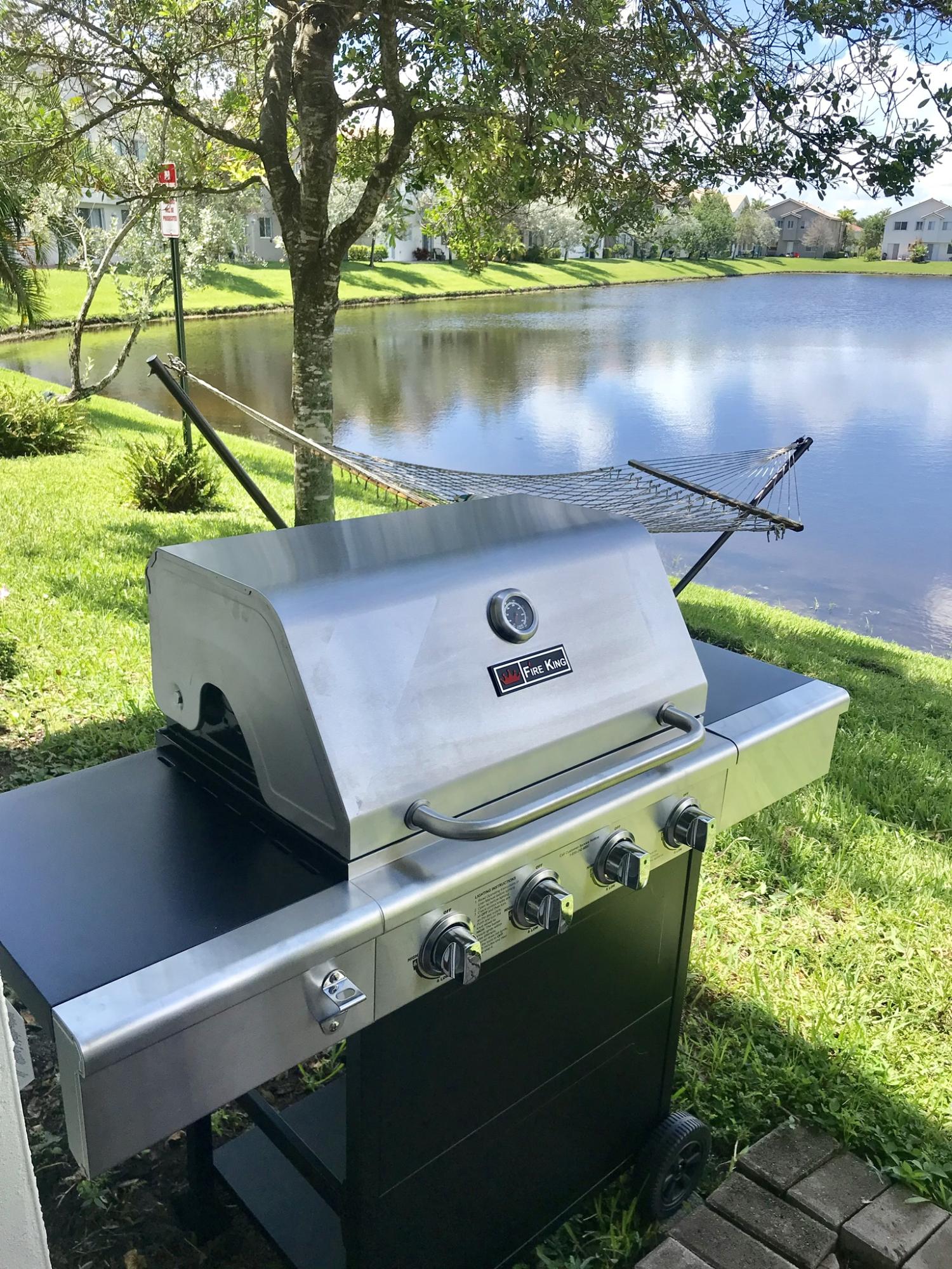 3216 Laurel Ridge Circle Riviera Beach, FL 33404 - Photo 27 of 40 Grill from patio off kitchen