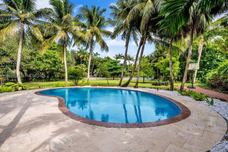 7405 Southwest 79th Court Miami, FL 33143 - Photo 14 of 29 a view of swimming pool with a yard