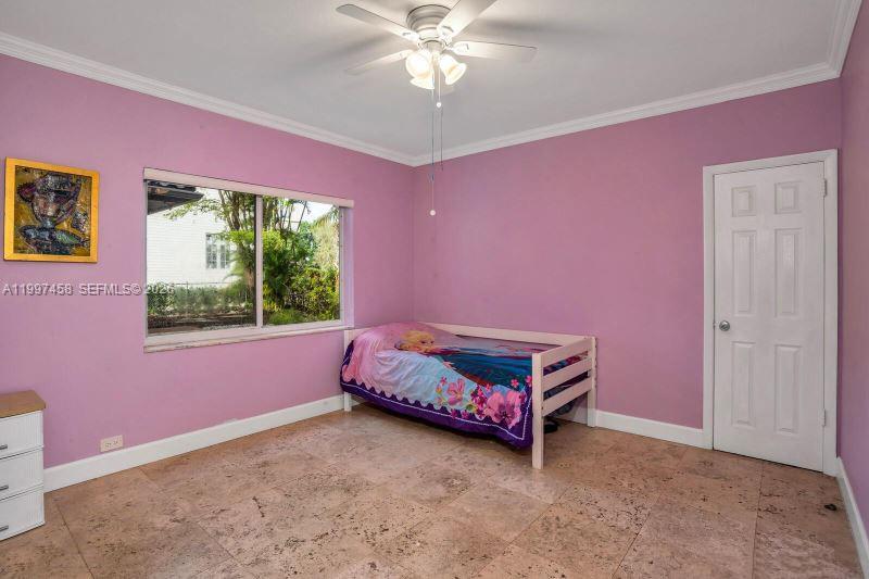 7405 Southwest 79th Court Miami, FL 33143 - Photo 19 of 29 a room with furniture and a ceiling fan