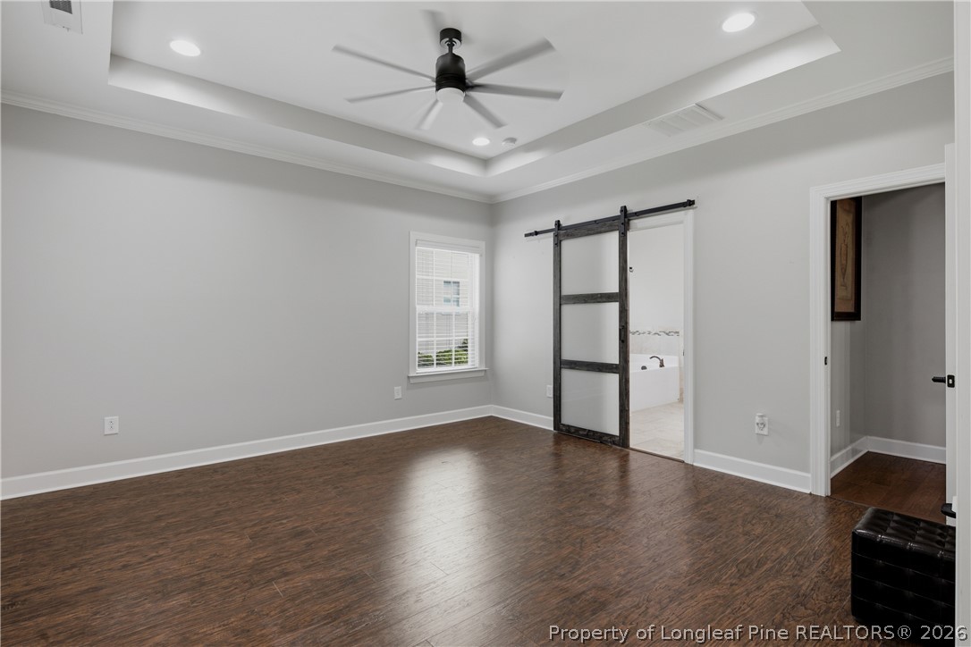 148 Heatherspring Way Spring Lake, NC 28390 - Photo 25 of 50 wooden floor in an empty room with a window
