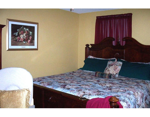 30 Prouty Street Springfield, MA 01119 - Photo 6 of 8 a bedroom with a bed and dresser