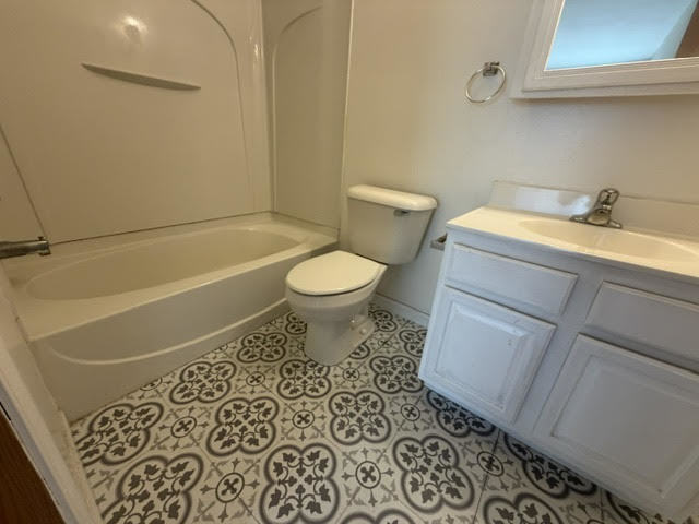 126 Washington Street, Unit A Ingleside, IL 60041 - Photo 8 of 9 a bathroom with a toilet and a sink