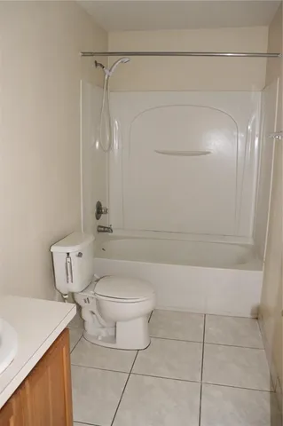 a bathroom with a toilet a sink and bathtub