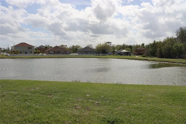a view of a porch with furniture and garden