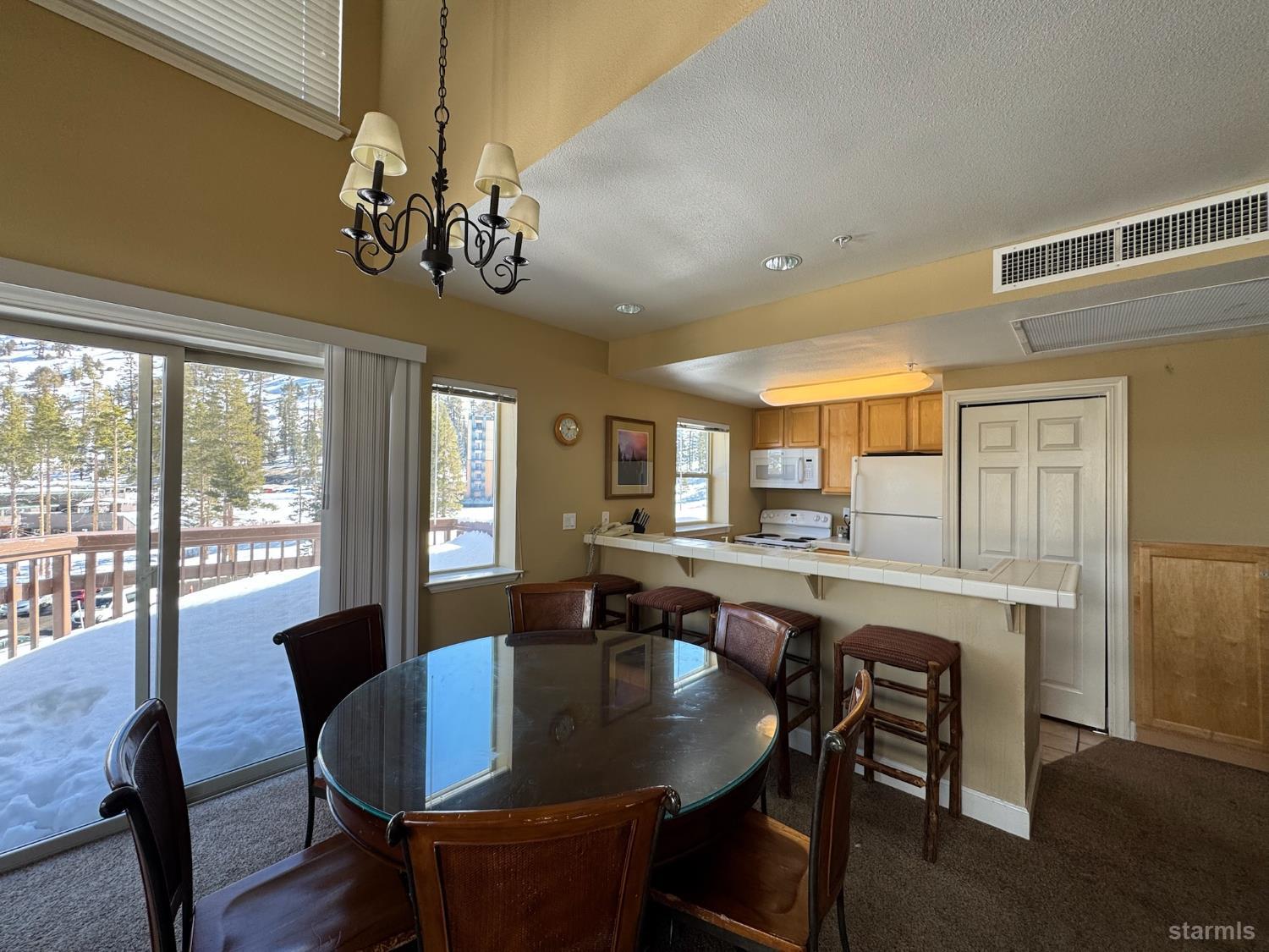 1399 Kirkwood Meadows Drive, Unit R220 Kirkwood, CA 95646 - Photo 24 of 40 a view of a dining room with furniture window and outside view
