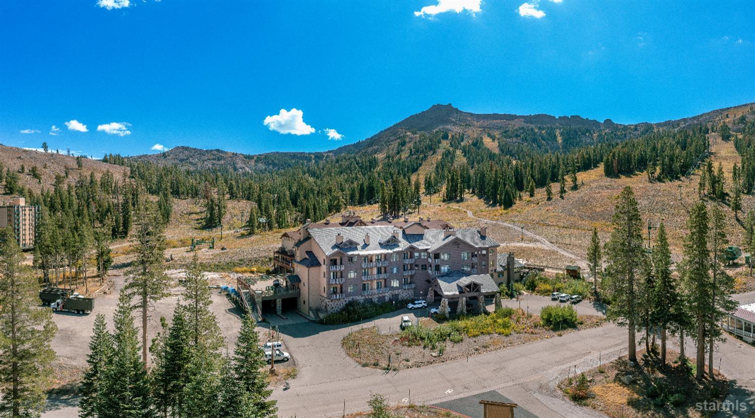 1399 Kirkwood Meadows Drive, Unit R220 Kirkwood, CA 95646 - Photo 34 of 40 a view of a swimming pool with a patio and a yard