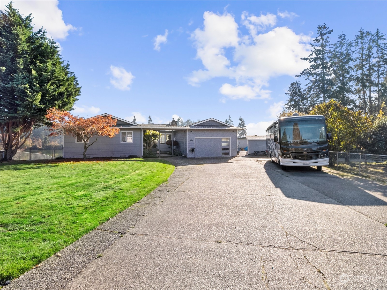 1304 153rd Street South Spanaway, WA 98387 - Photo 2 of 39 a car parked on the side of the road