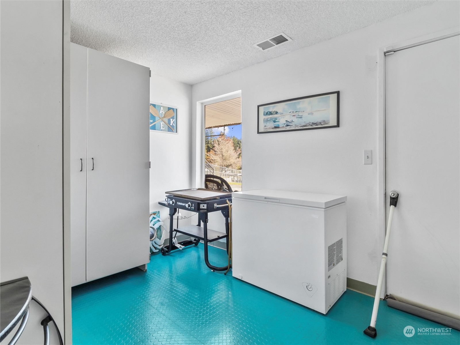 1304 153rd Street South Spanaway, WA 98387 - Photo 26 of 39 a view of a workspace with wooden floor and a workspace