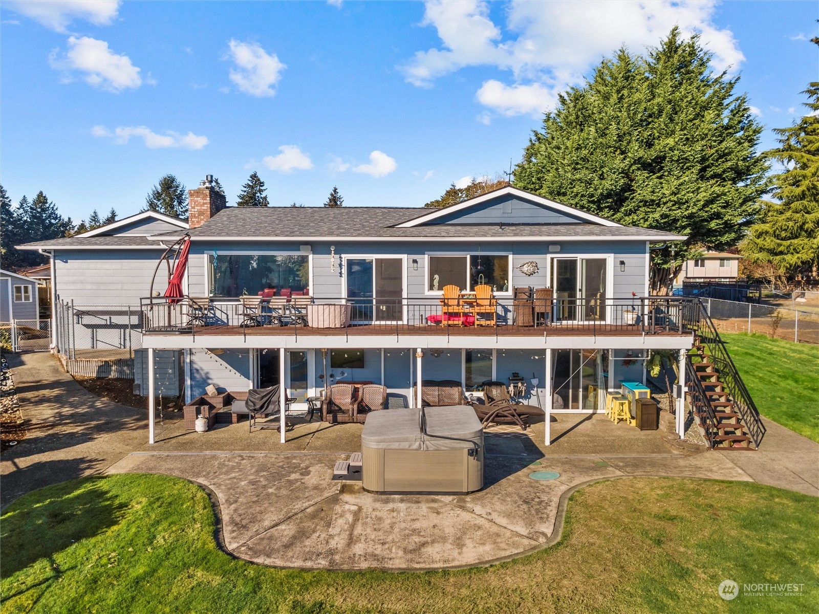 1304 153rd Street South Spanaway, WA 98387 - Photo 29 of 39 a view of a house with a swimming pool