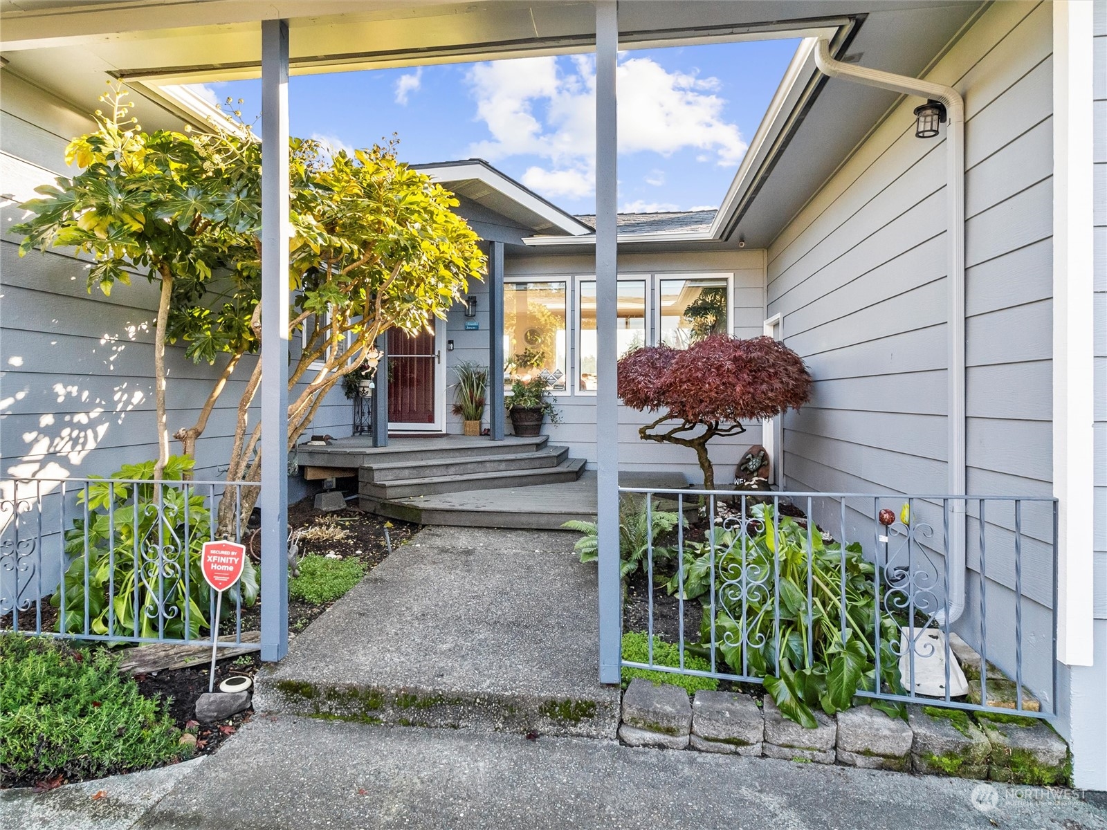 1304 153rd Street South Spanaway, WA 98387 - Photo 4 of 39 a front view of a house with a yard