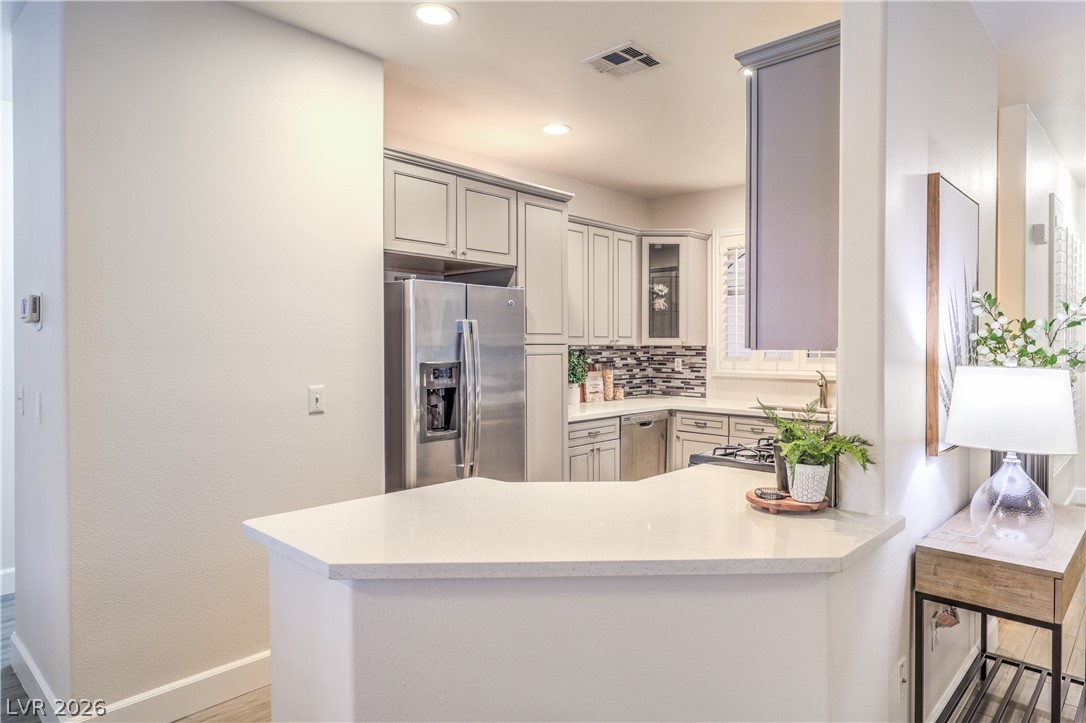 2050 West Warm Springs Road, Unit 1421 Henderson, NV 89014 - Photo 15 of 45 An inviting kitchen with pristine counters and modern stainless steel appliances.