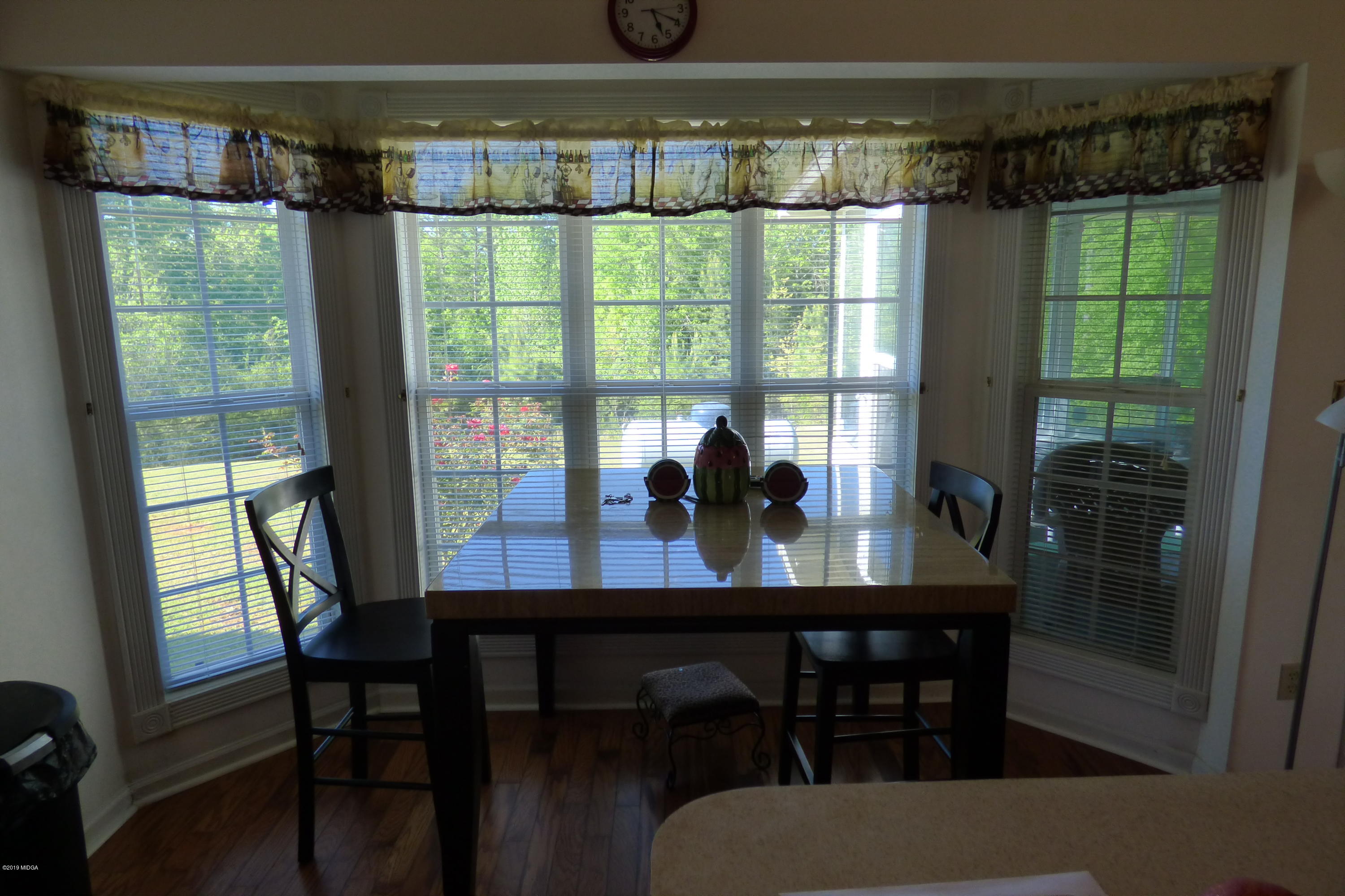 323 Rustin Road Reynolds, GA 31076 - Photo 17 of 25 a view of a dining room with furniture window and outside view