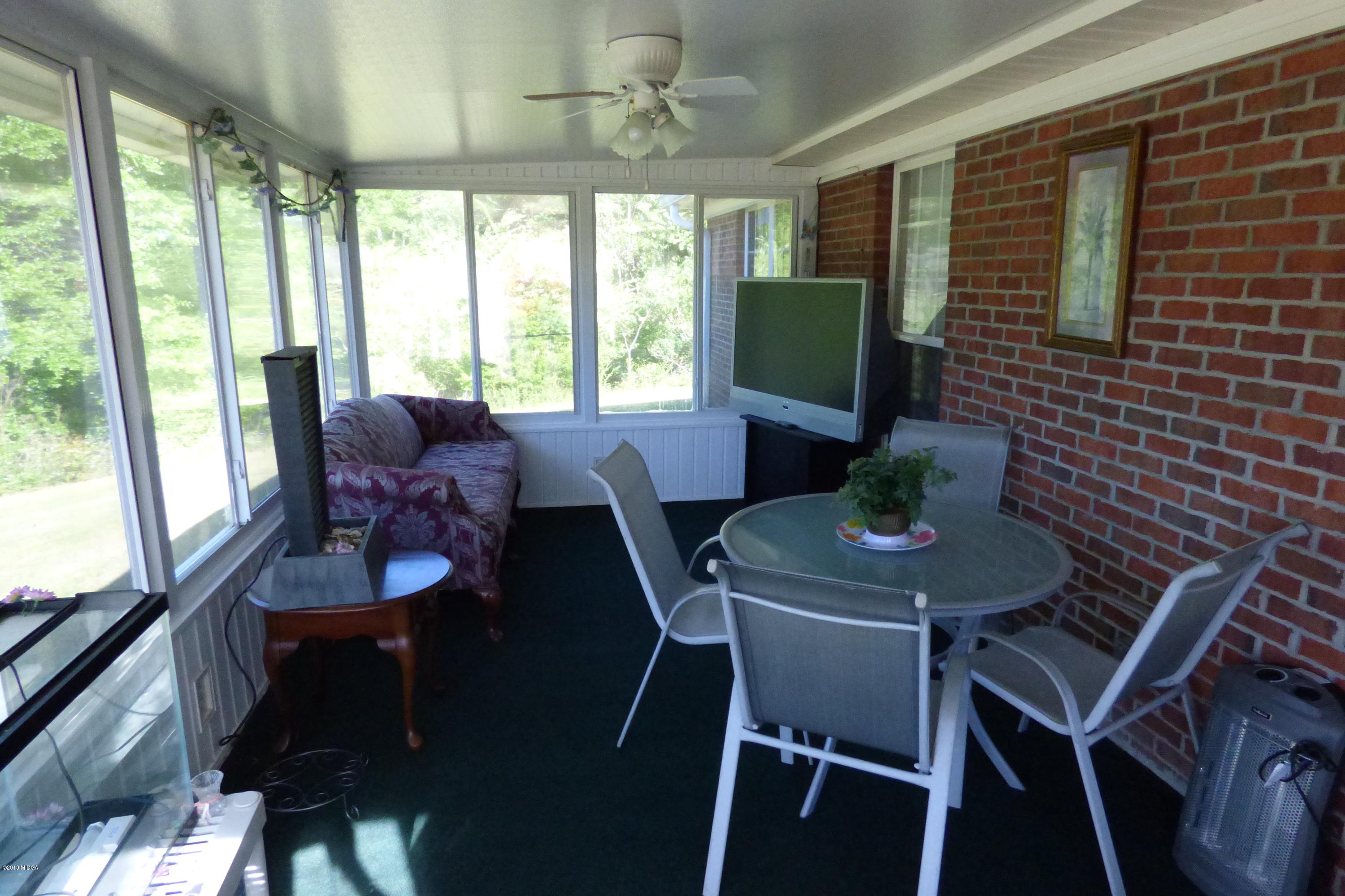 323 Rustin Road Reynolds, GA 31076 - Photo 18 of 25 a view of a dining room with furniture window and outside view
