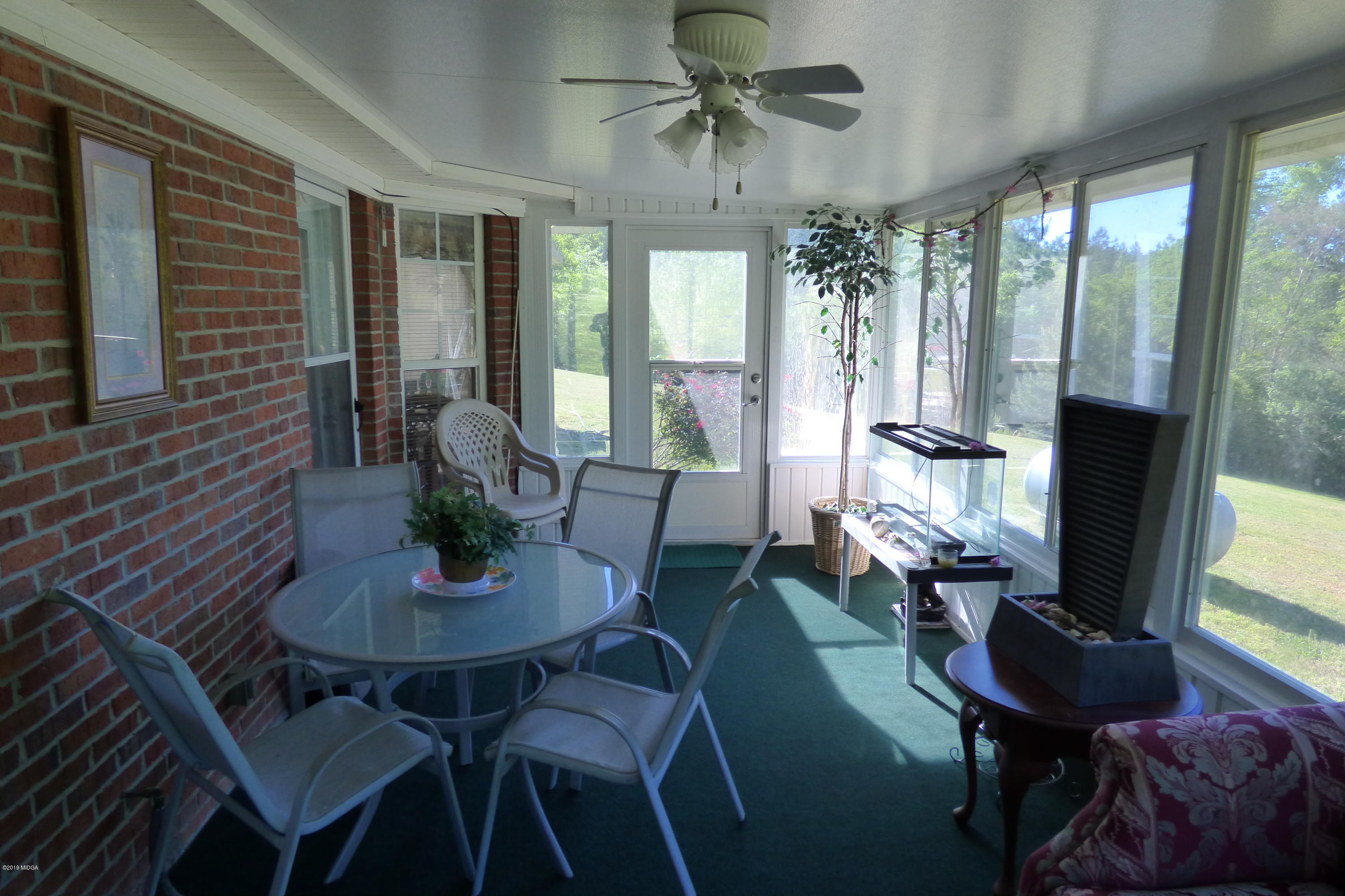 323 Rustin Road Reynolds, GA 31076 - Photo 19 of 25 a view of a dining room with furniture window and outside view