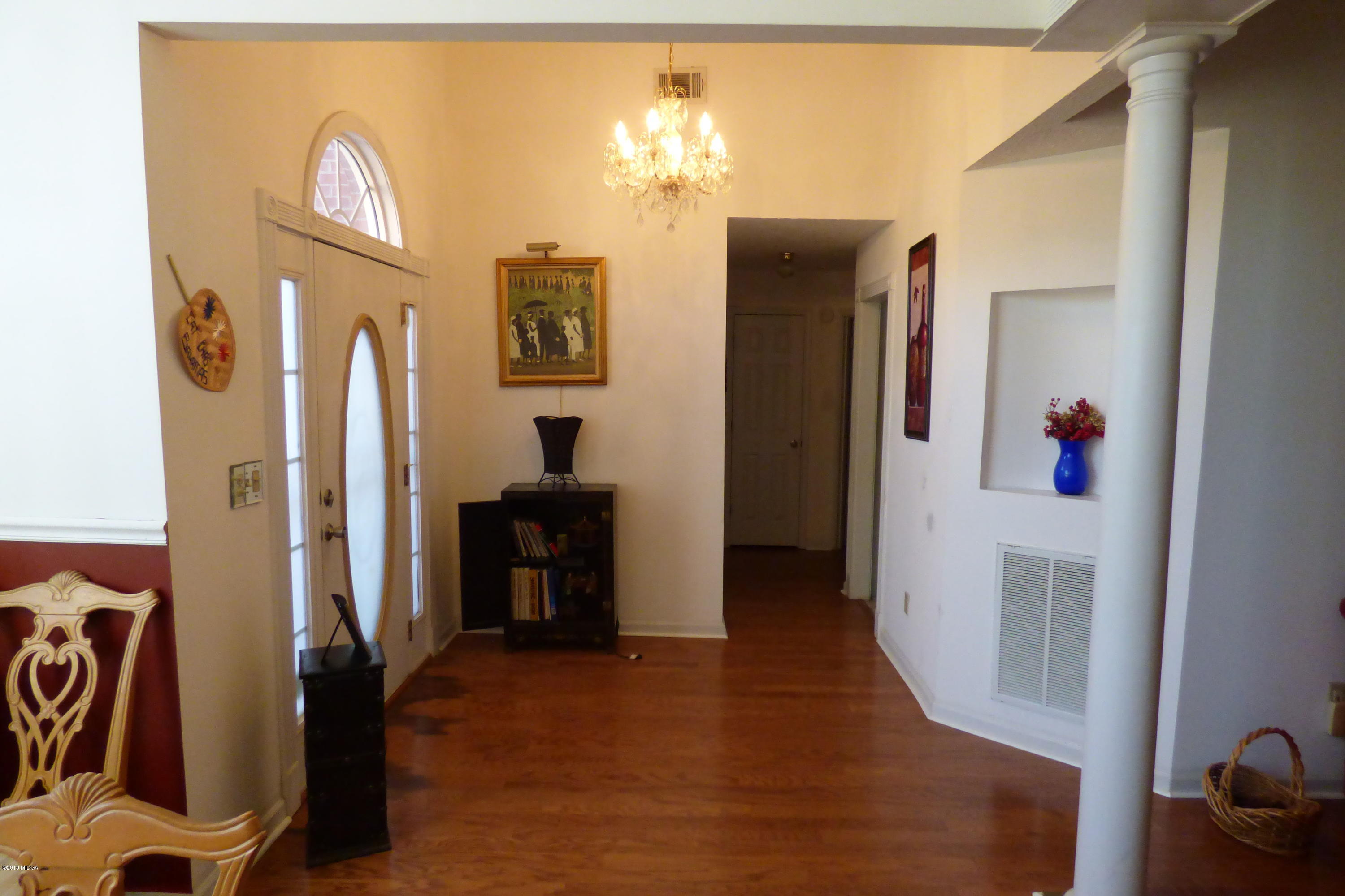 323 Rustin Road Reynolds, GA 31076 - Photo 9 of 25 a view of a kitchen with furniture and a refrigerator
