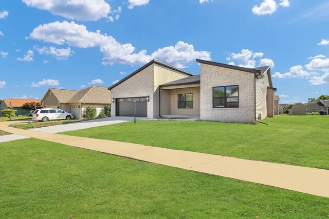 a view of house with outdoor space and porch