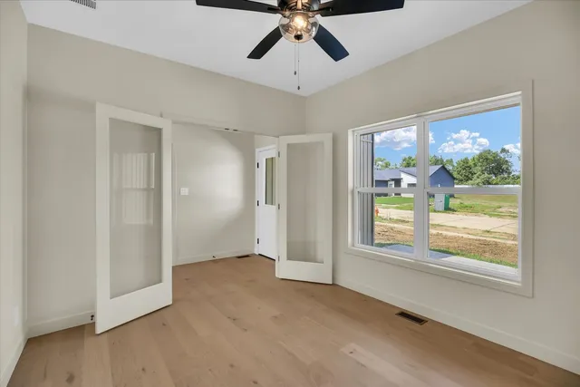 a view of an empty room with a window