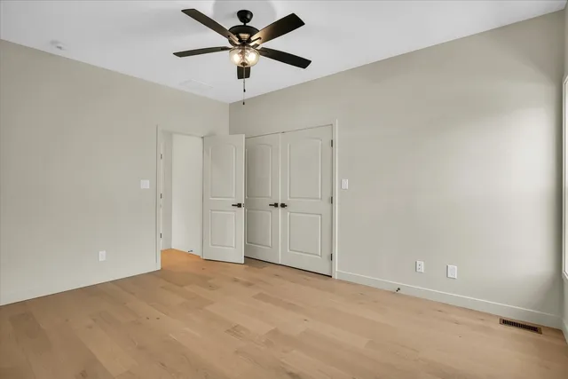 a bathroom with a sink a toilet and a shower