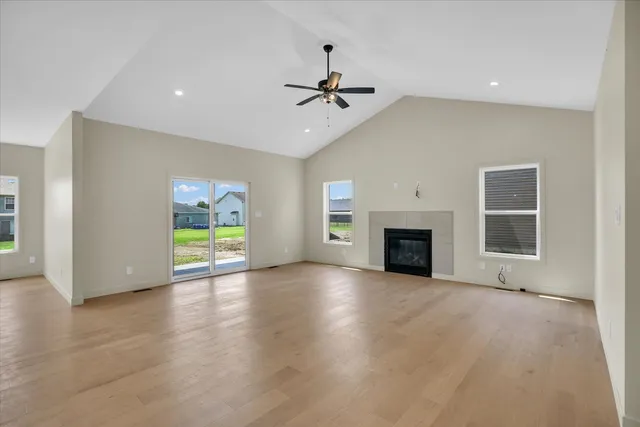 a view of an empty room with a fireplace