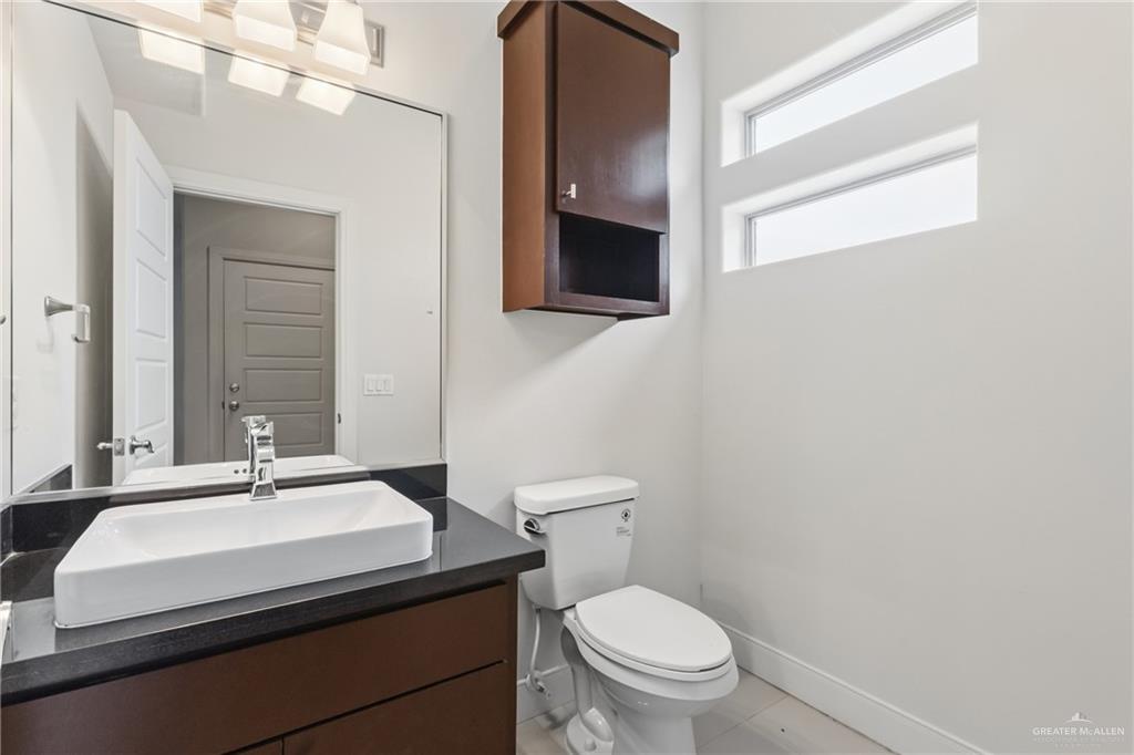 3016 South L Street, Unit 2 McAllen, TX 78503 - Photo 14 of 16 a bathroom with a sink and a toilet
