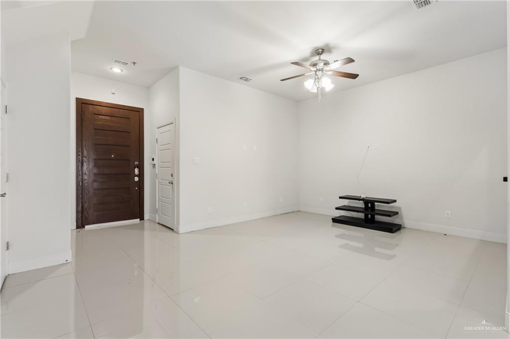 3016 South L Street, Unit 2 McAllen, TX 78503 - Photo 2 of 16 a view of a livingroom with a ceiling fan and window