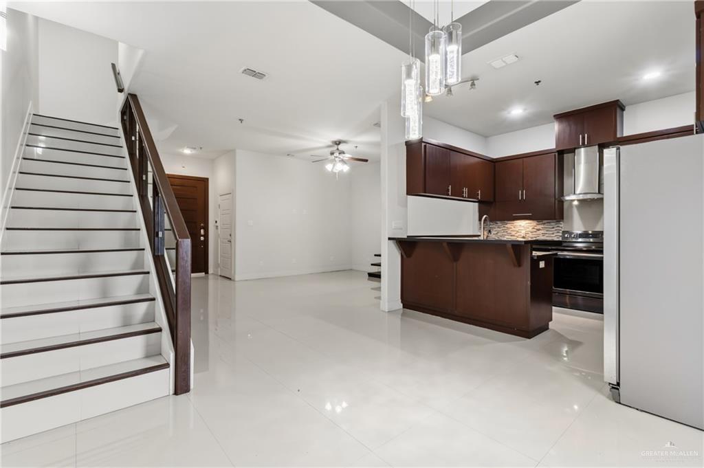 3016 South L Street, Unit 2 McAllen, TX 78503 - Photo 16 of 16 a kitchen with cabinets and wooden floor
