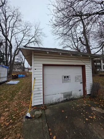 a house that has a tree in front of the house