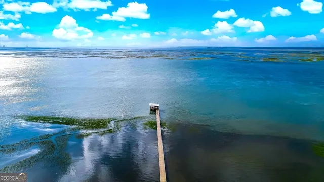 a view of a lake with a big yard