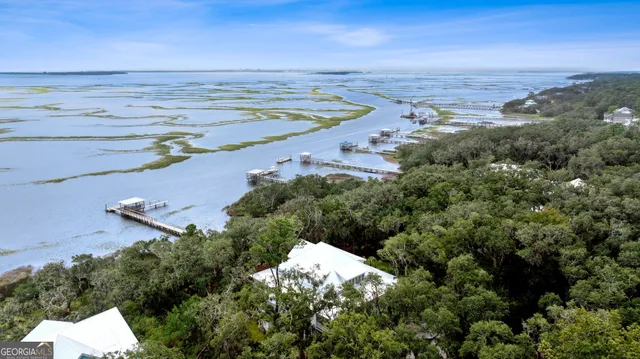 a view of a lake with a yard