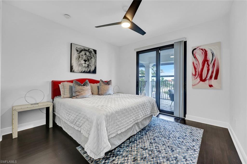 494 Seagull Avenue Naples, FL 34108 - Photo 19 of 32 a bedroom with a bed and a painting on the wall