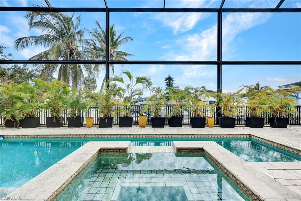 494 Seagull Avenue Naples, FL 34108 - Photo 22 of 32 a view of a living room with furniture and a potted plant